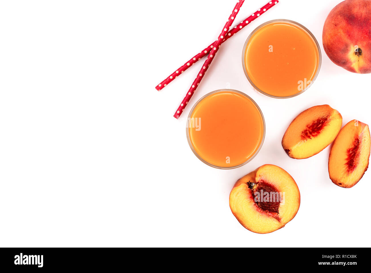 peach juice isolated on white background with copy space for your text. Top view. Flat lay pattern Stock Photo