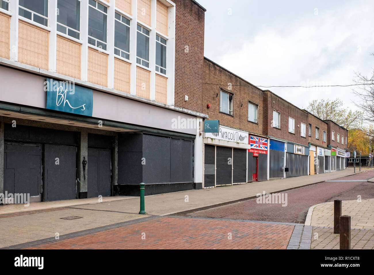 Whole street with shops closed down and boarded up in Crewe Cheshire UK Stock Photo