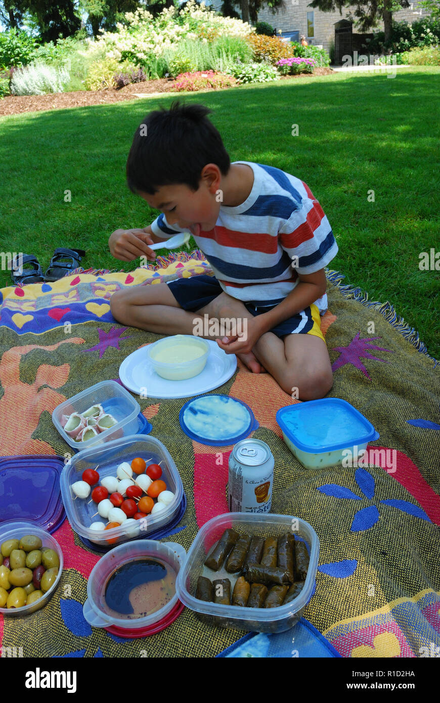 boy eating soup at picnic in Niagara on the Lake Stock Photo