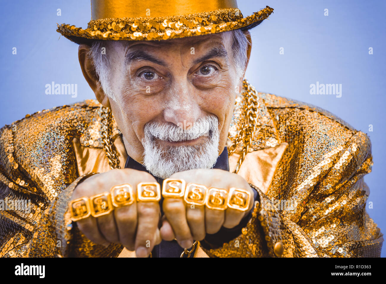 Funny And Extravagant Senior Man Posing On Colored Background