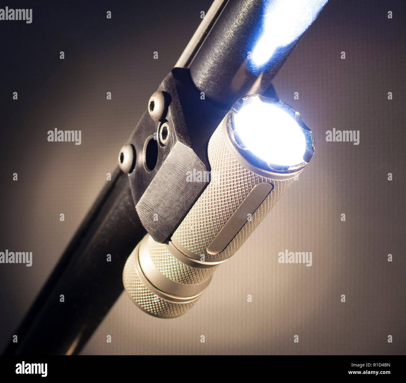 Flashlight mounted an running under a shotgun barrel Stock Photo Alamy