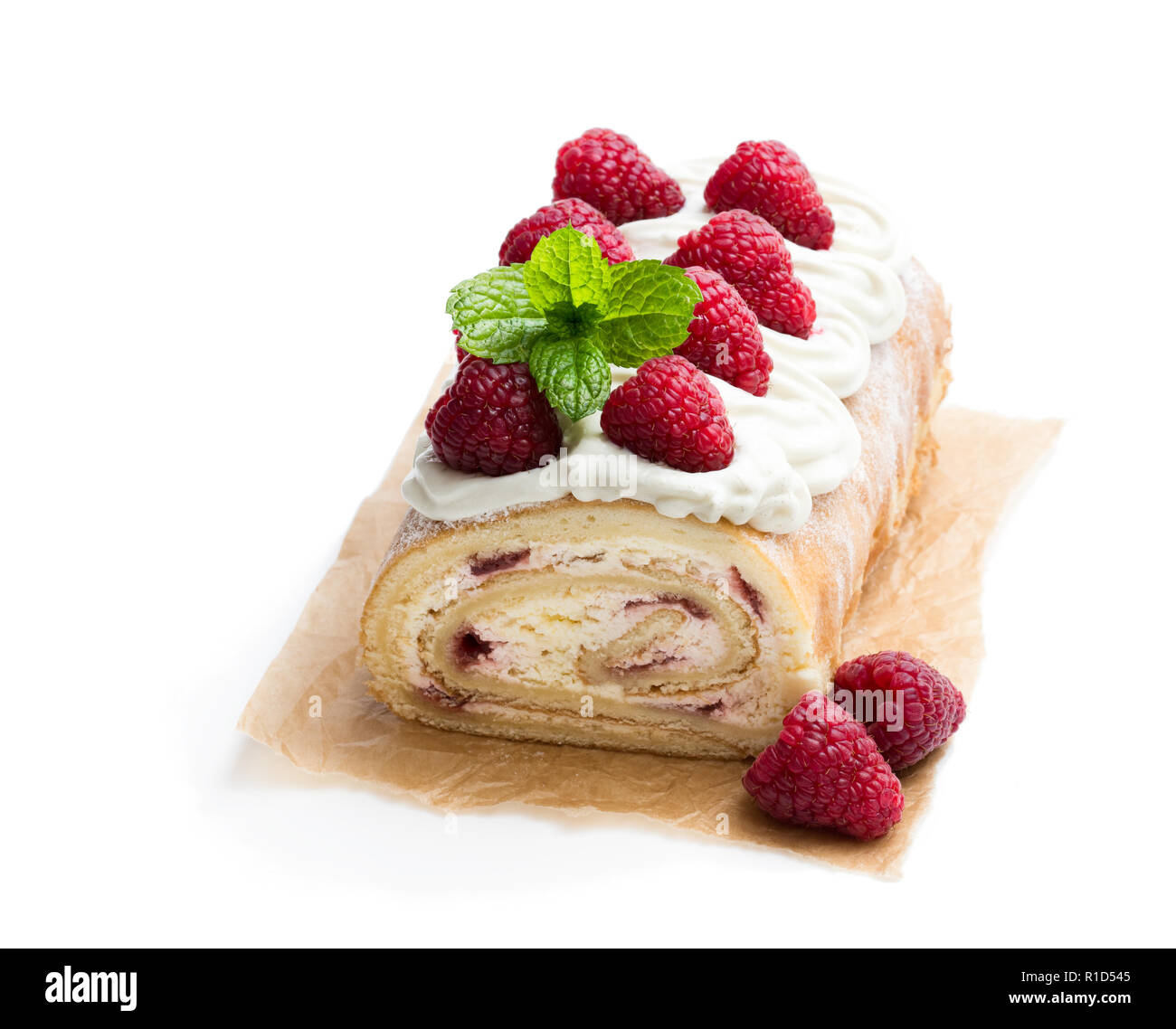 Homemade swiss roll cake with raspberry isolated on white Stock Photo
