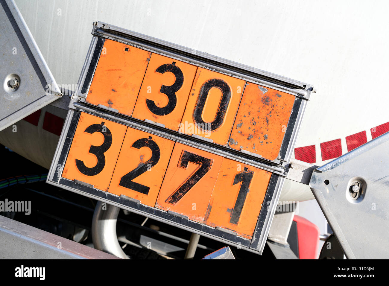 orange-colored plate with hazard-identification number 30 and UN-Number 3271 (ETHERS, N.O.S.) Stock Photo