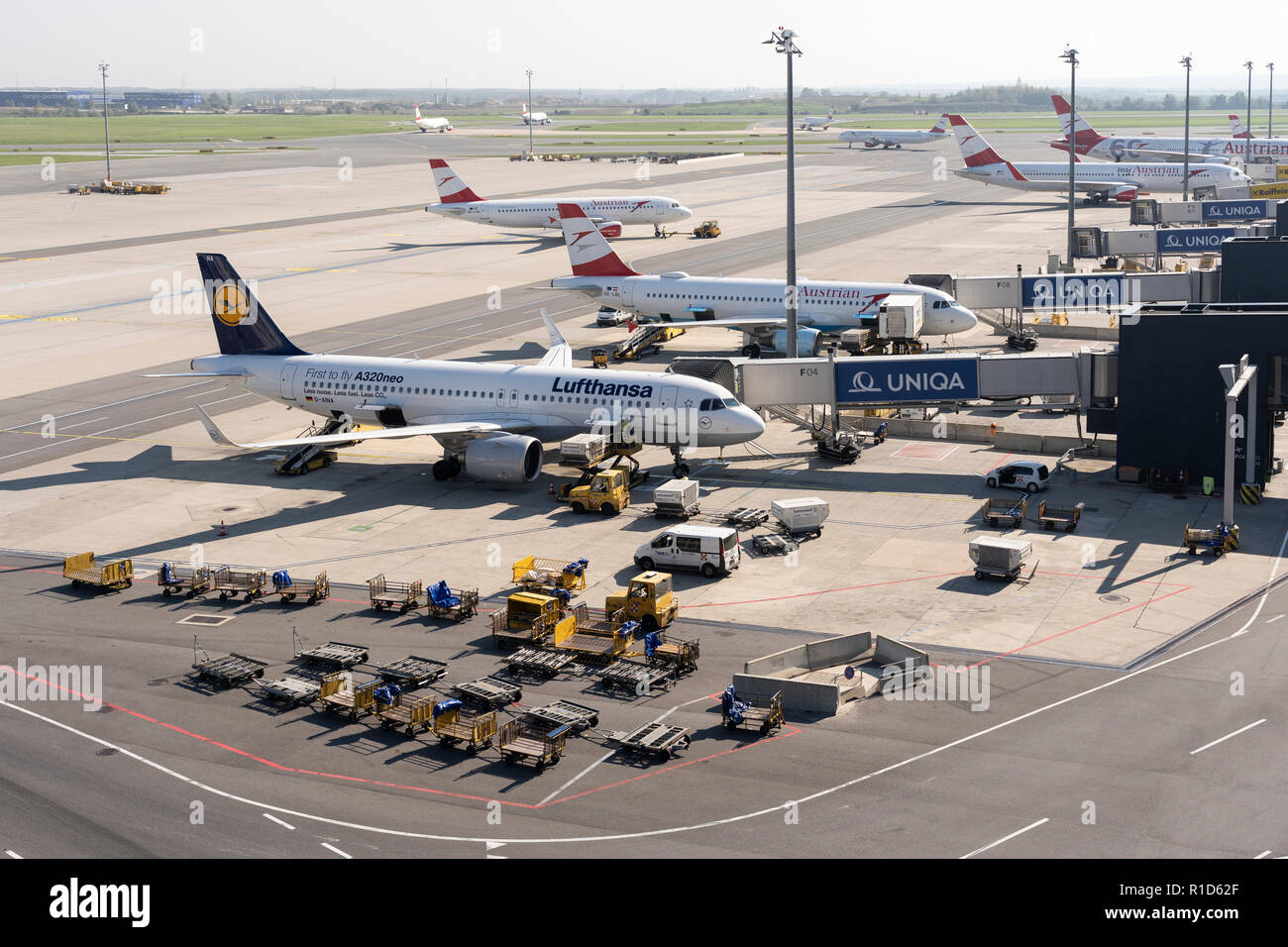 Luggage being loaded onto a Lufthansa passenger jet at Vienna International Airport Stock Photo