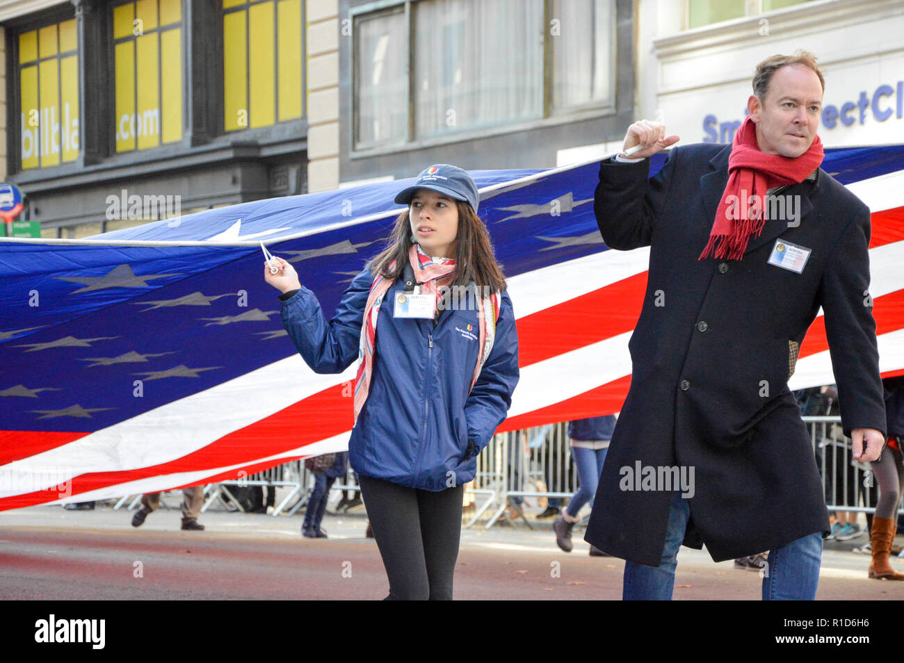 Participants seen holding a huge flag during the parade. Thousands from more than 300 units in the Armed Forces took part in the Annual Veterans Day Parade. The Veterans Day Parade took place along the 5th Avenue in New York City honoring the service of those who’ve served in the U.S. Armed Forces. Stock Photo