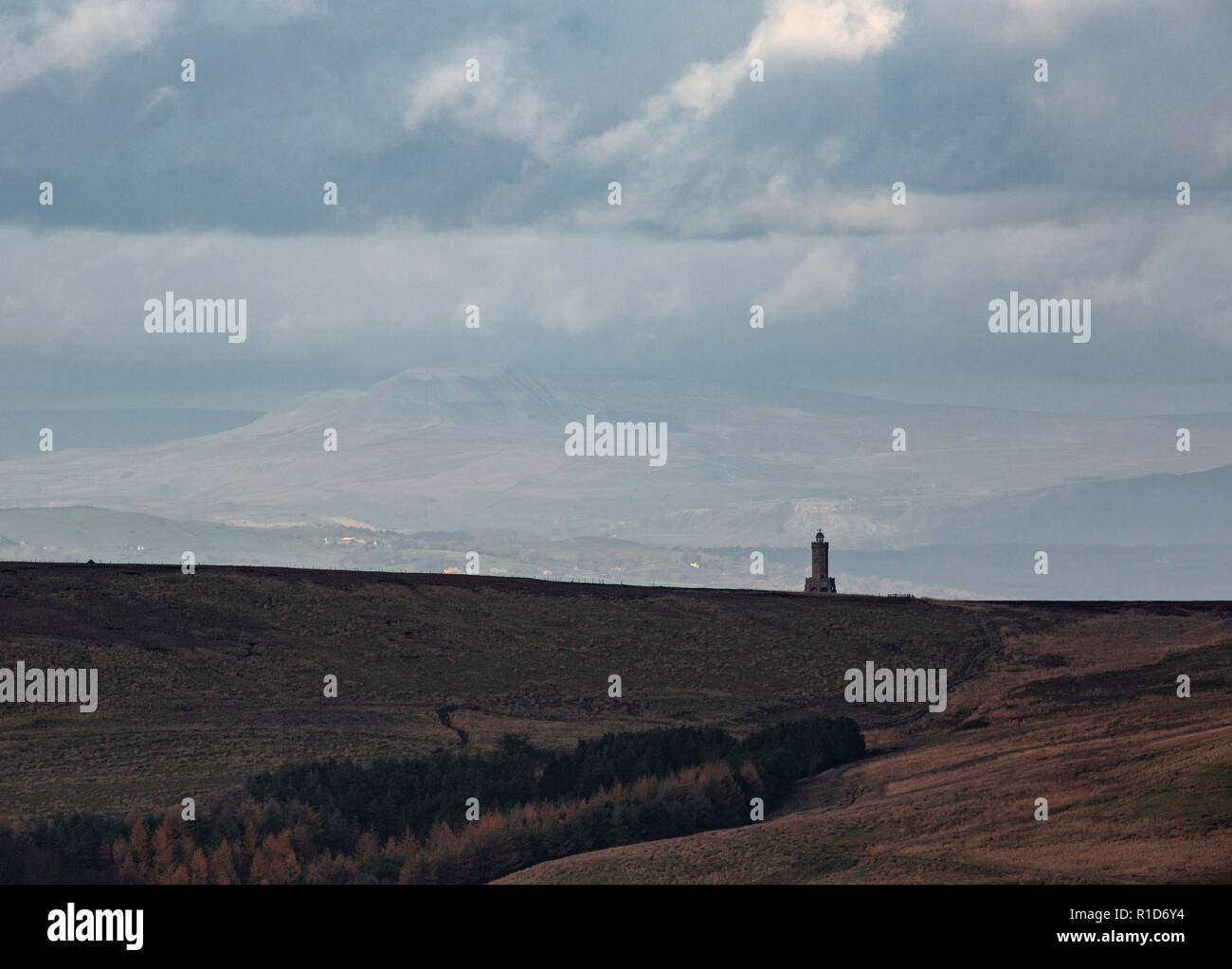 Darwen Tower viewed from Winter Hill with distant landscape beyond. Stock Photo
