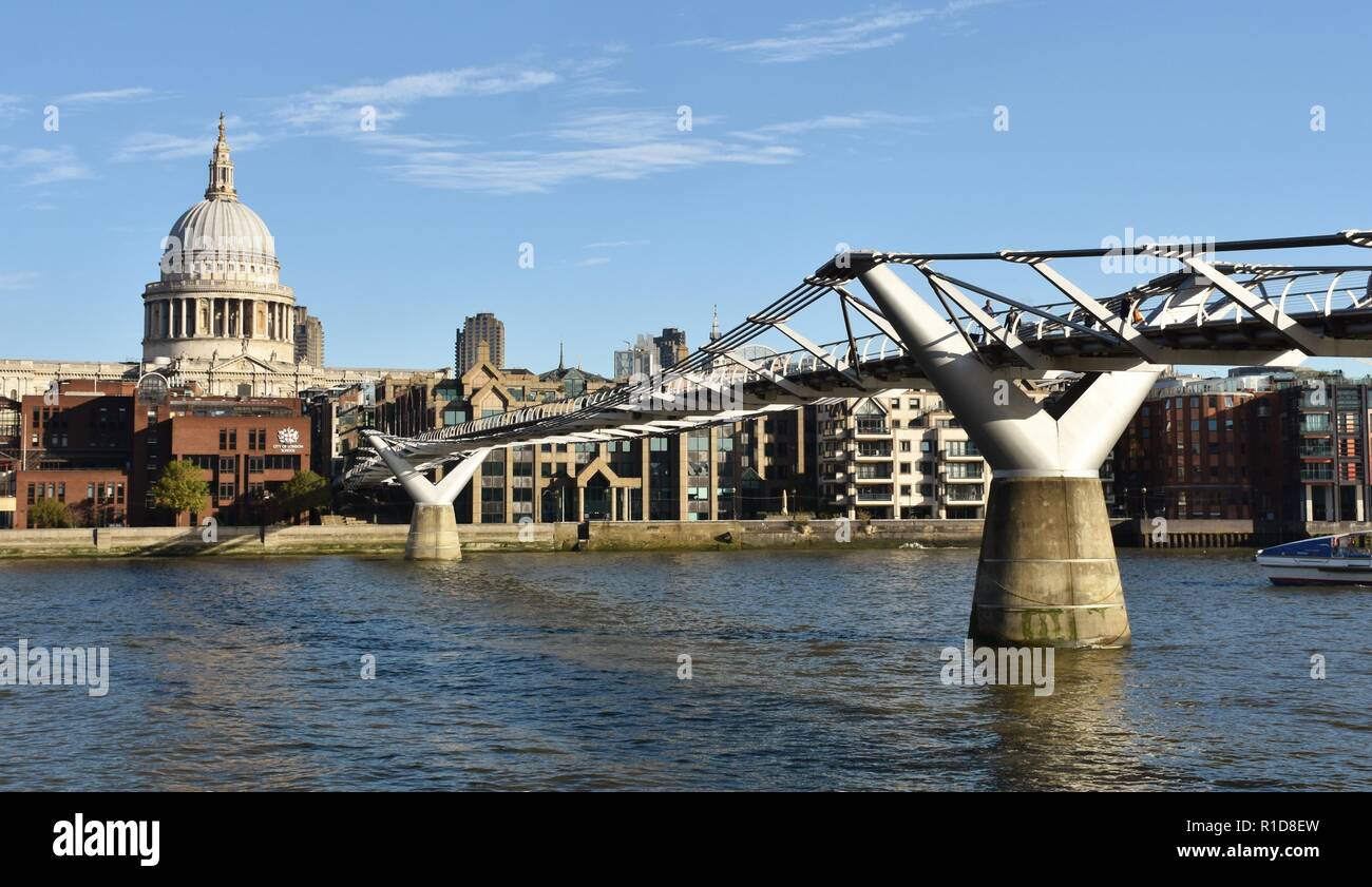 The Millennium Bridge in London, which crosses the Thames River and connects St. Paul's Cathedral to the Tate Modern. Stock Photo