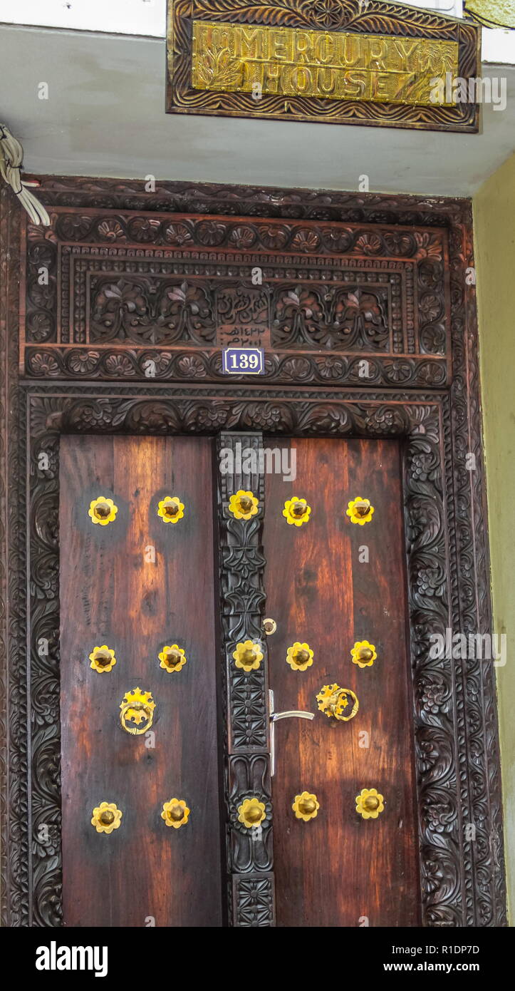 Stone Town, Zanzibar - The front door of the house in Kenyatta Street where Freddie Mercury lived before relocating to the U.K. image in portrait form Stock Photo