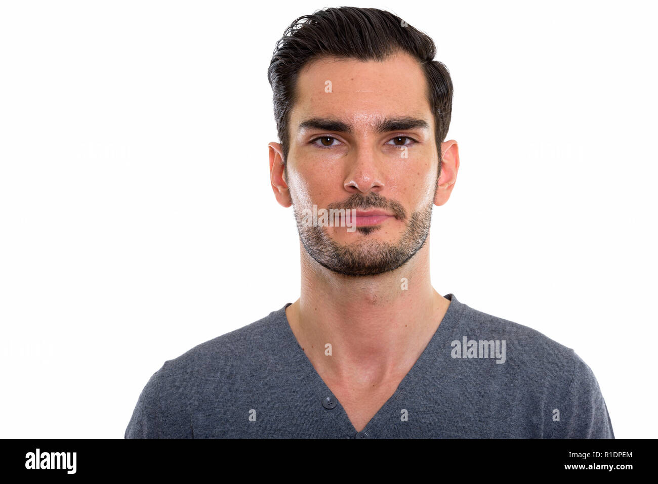 Studio shot of young handsome man looking at camera Stock Photo