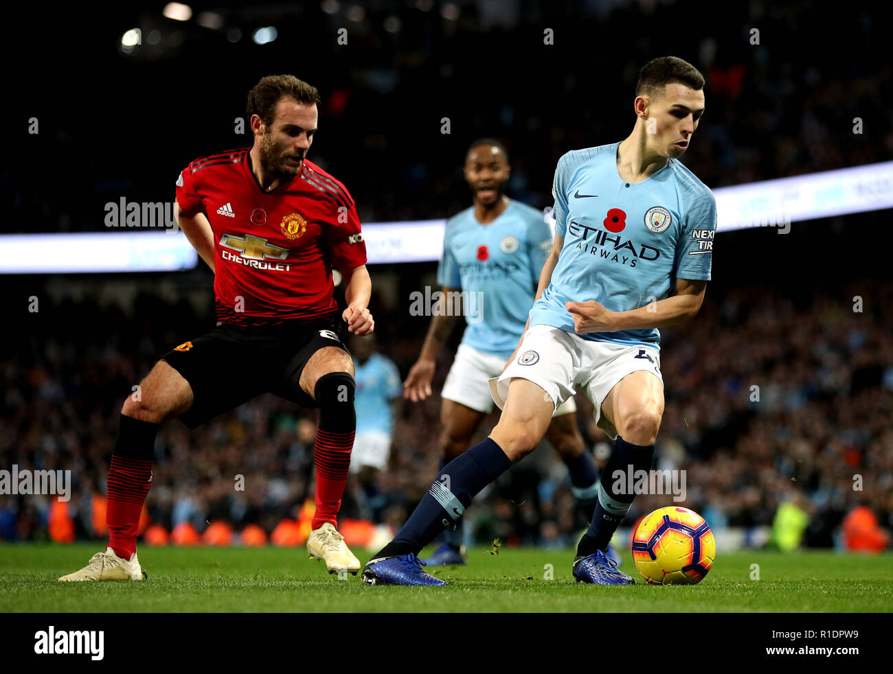 Manchester City's Phil Foden (right) in action during the Premier League match at the Etihad Stadium, Manchester. Stock Photo