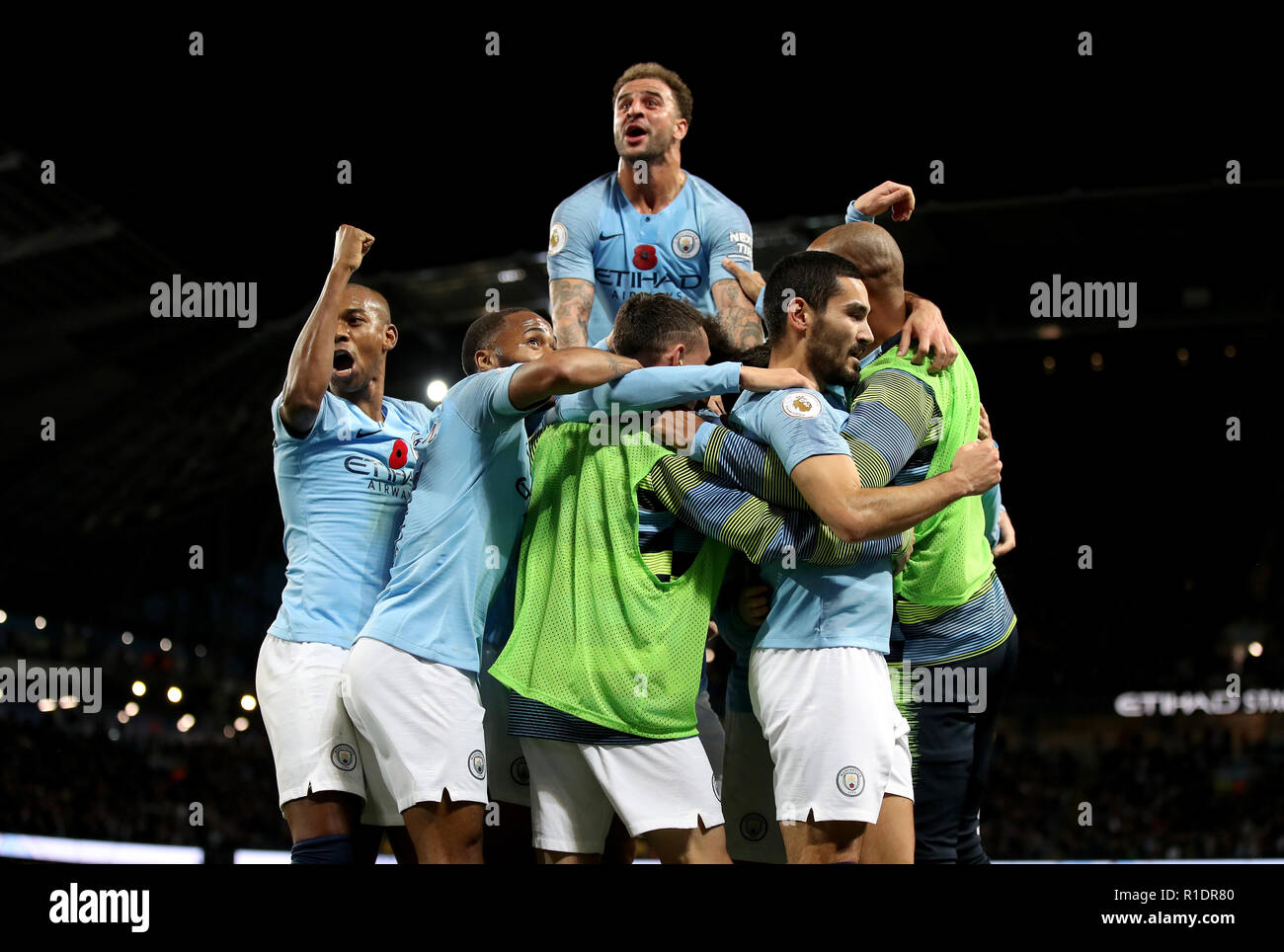 Manchester City's Ilkay Gundogan (right) celebrates scoring his side's third goal of the game with his team-mates during the Premier League match at the Etihad Stadium, Manchester. Stock Photo