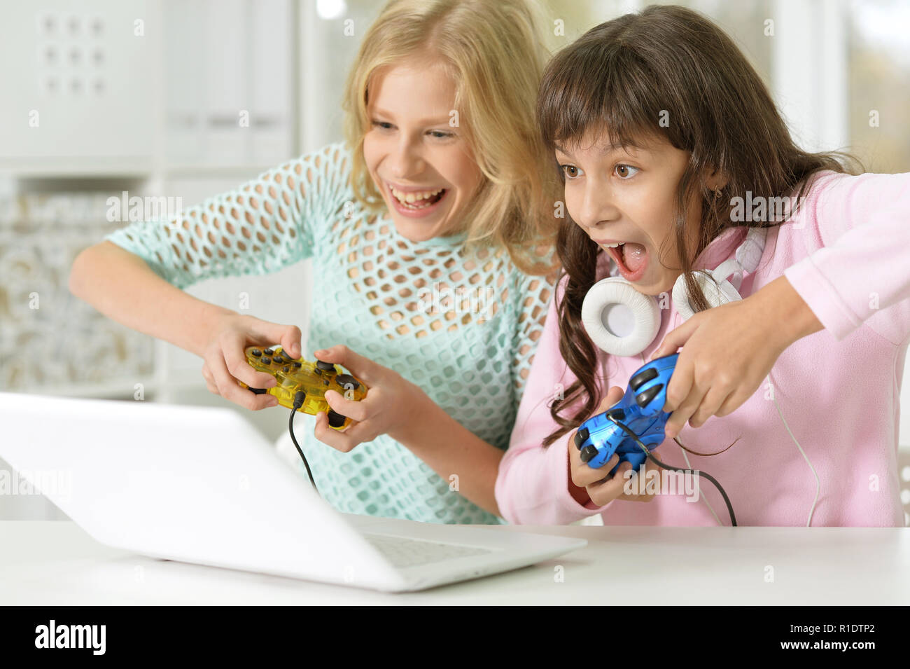 Portrait of little girl using modern laptop Stock Photo - Alamy