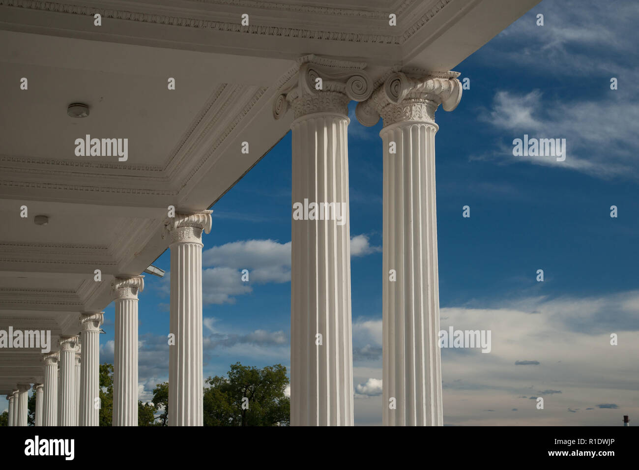 Columns on blue sky background Stock Photo - Alamy
