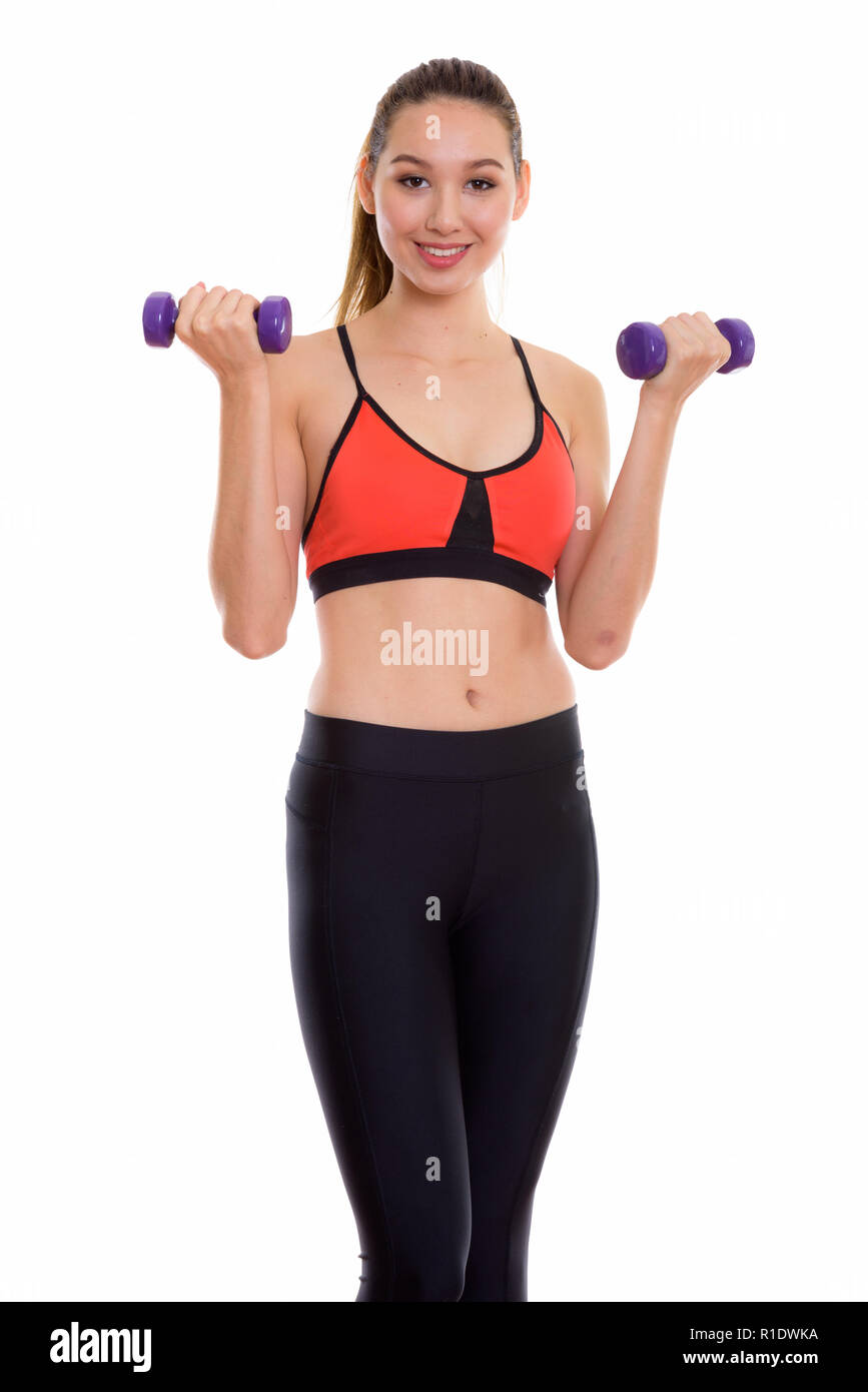 Studio shot of young happy beautiful Asian woman smiling while e Stock ...