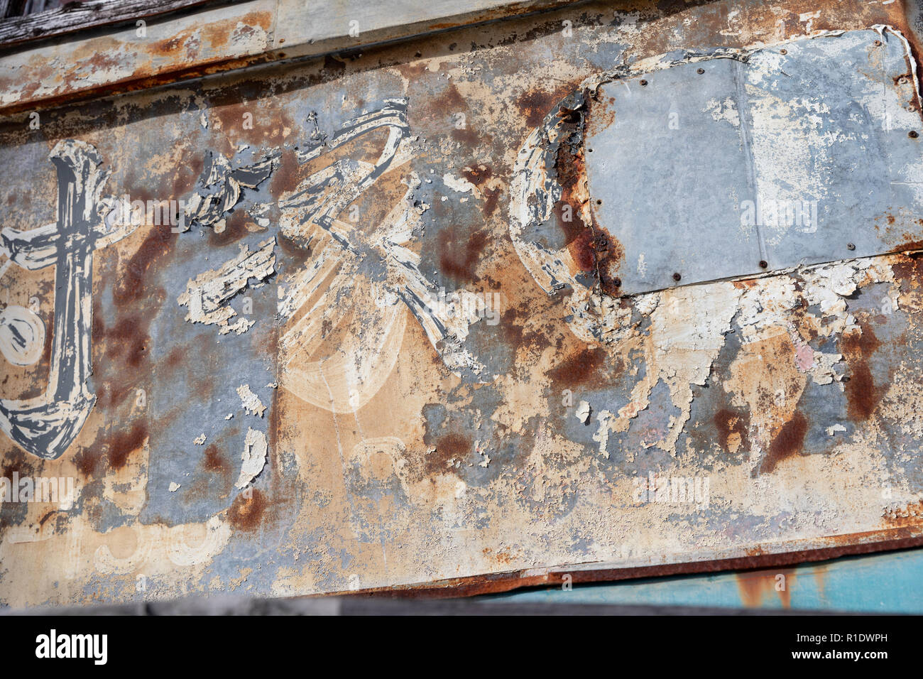 Rusty Japanese sign with peeling paint, detail; store front in Naha City, Okinawa, Japan Stock Photo
