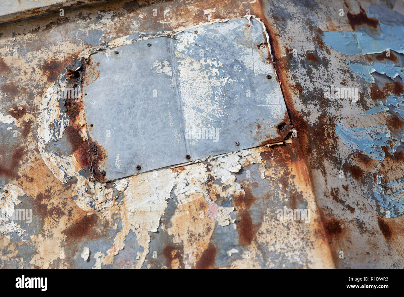 Rusty Japanese sign with peeling paint, detail; store front in Naha ...