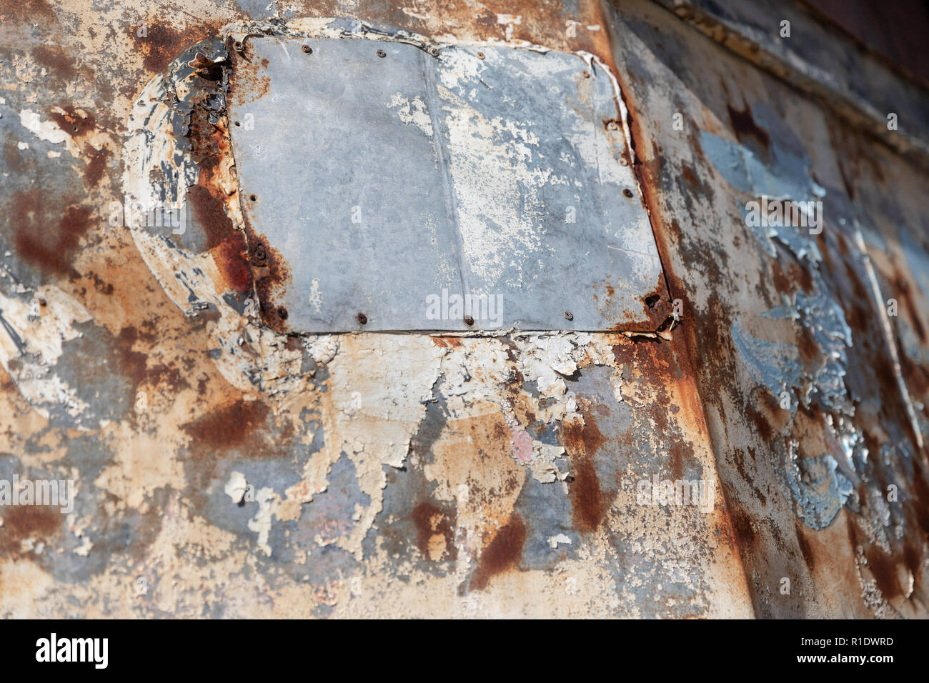 Rusty Japanese sign with peeling paint, detail; store front in Naha ...
