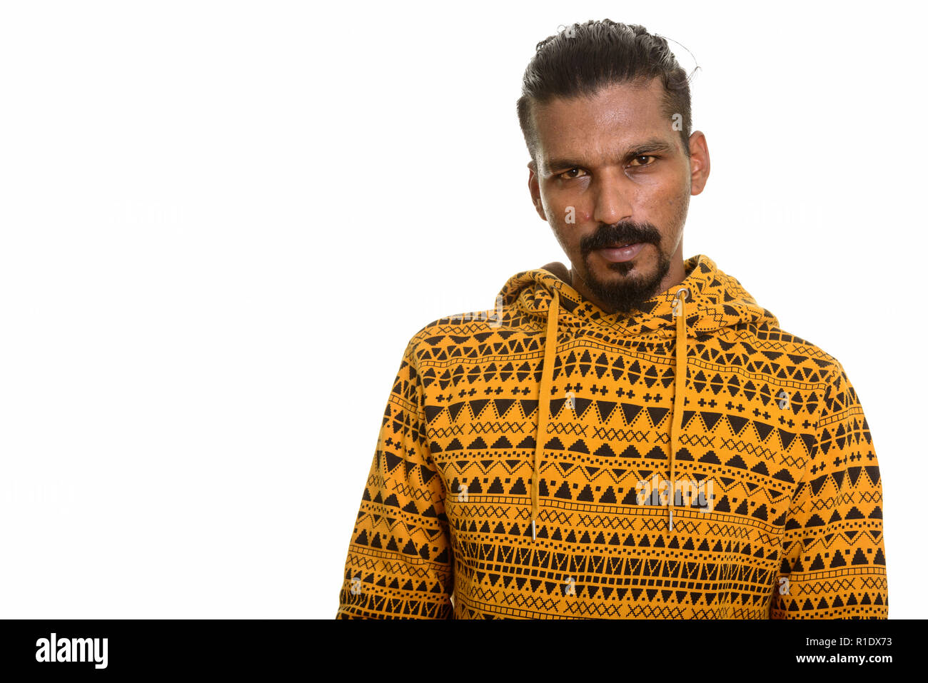 Young Indian man studio portrait against white background Stock Photo