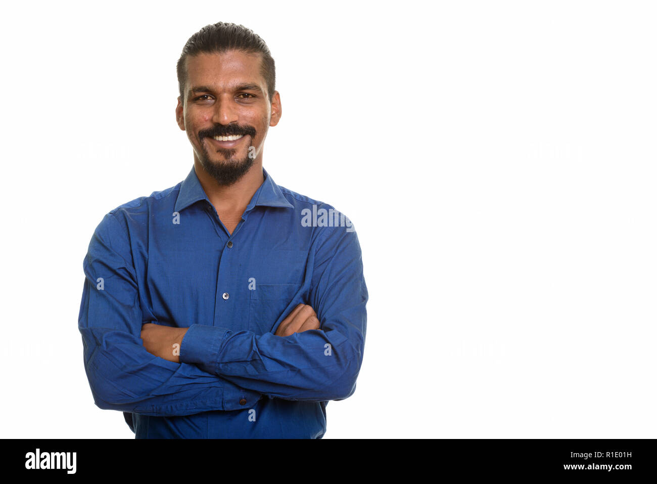 Young happy Indian businessman smiling with arms crossed Stock Photo ...