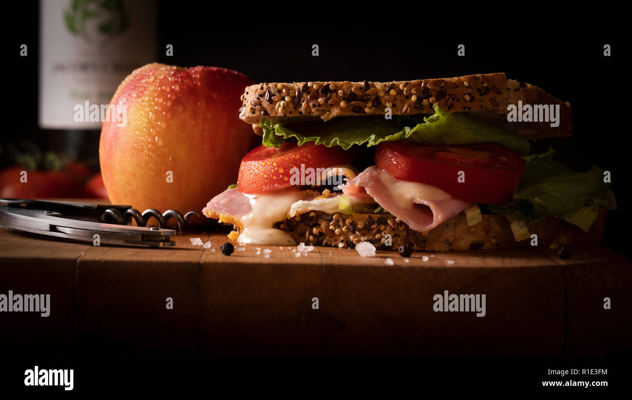 lunchtime seeded brown bread ham cheese and tomato sandwich Stock Photo