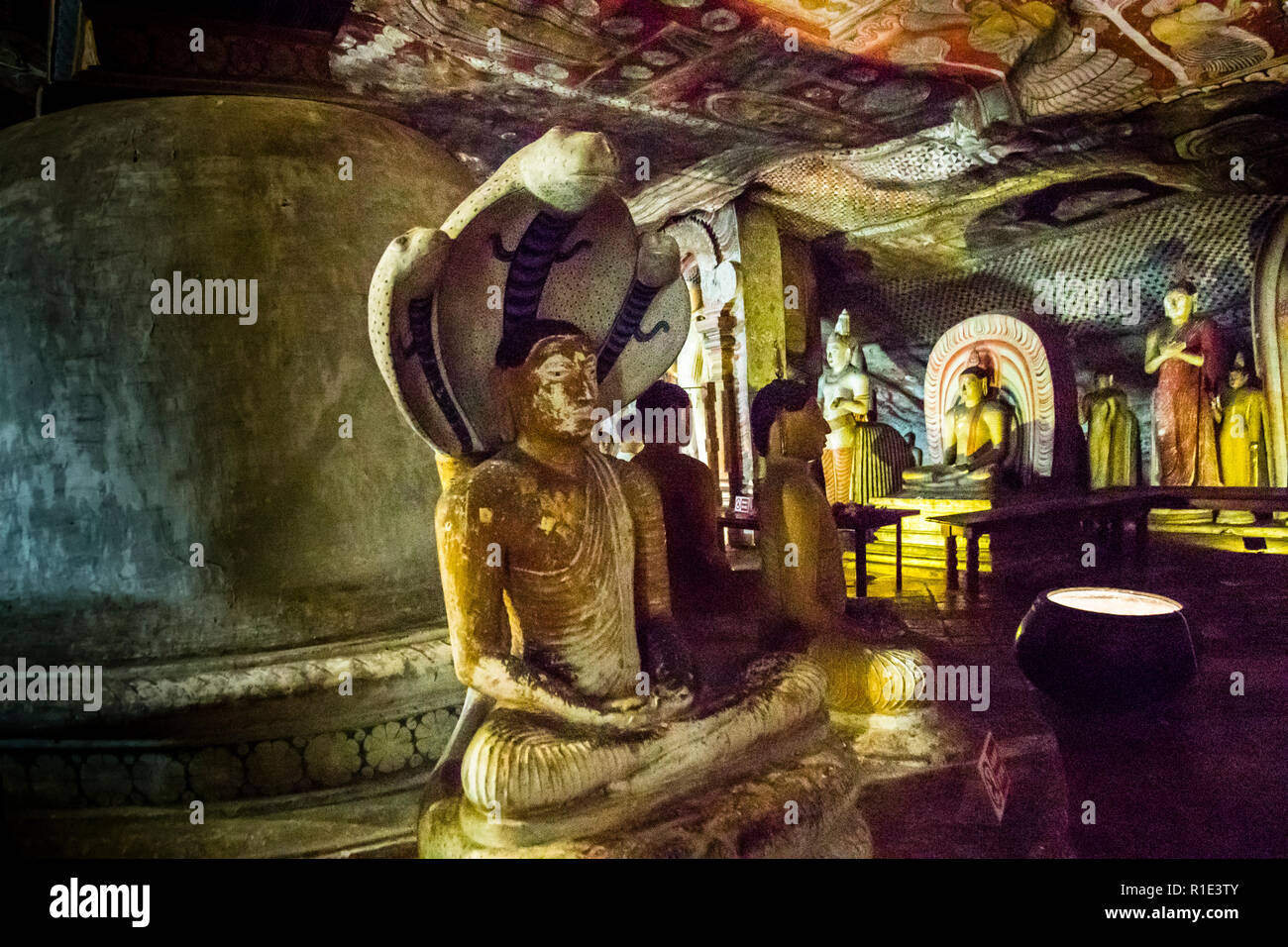 Dambulla Cave Temple, Sri Lanka. There are more than 48 Buddha statues in the cave temples of Dambulla. Naga statues represent Buddha protected by a king cobra while meditating Stock Photo