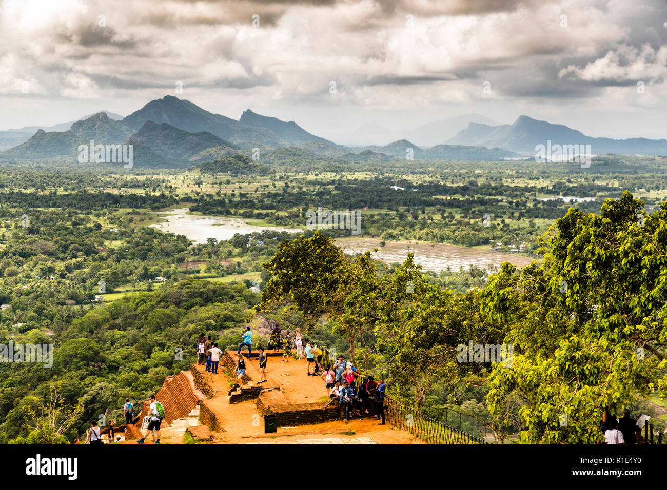 Breathtaking view from the Sigiriya rock fortress over rice fields and mountain ranges in the distance Stock Photo