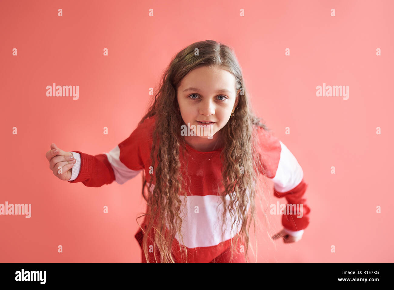 Young Beautiful Cute Girl Dancing On Red Background Modern
