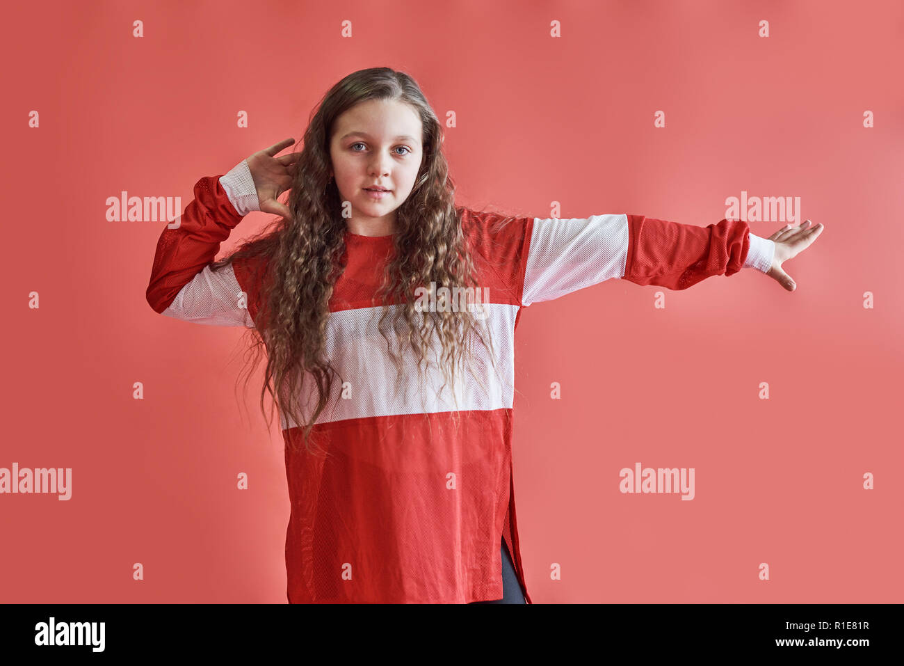 Young Beautiful Cute Girl Dancing On Red Background Modern