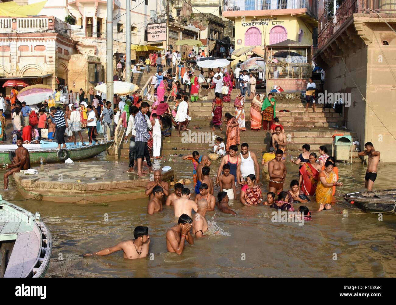 Varanasi, Hindus, Holy Ganges River. Hindus bathing in holy Ganges River and offering prayers. Stock Photo