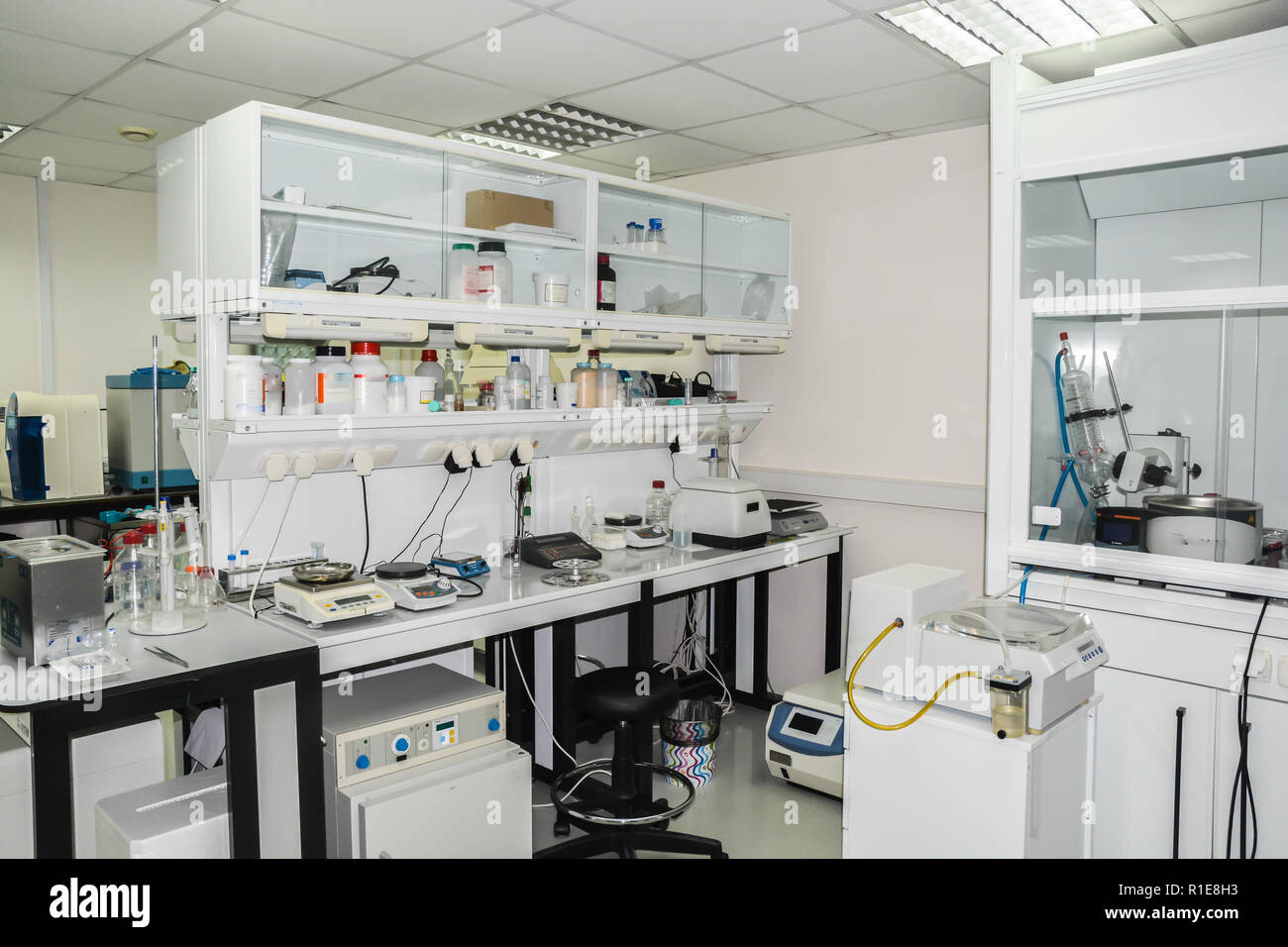 Modern chemical laboratory. The interior of the room is equipped for scientific research. Stock Photo