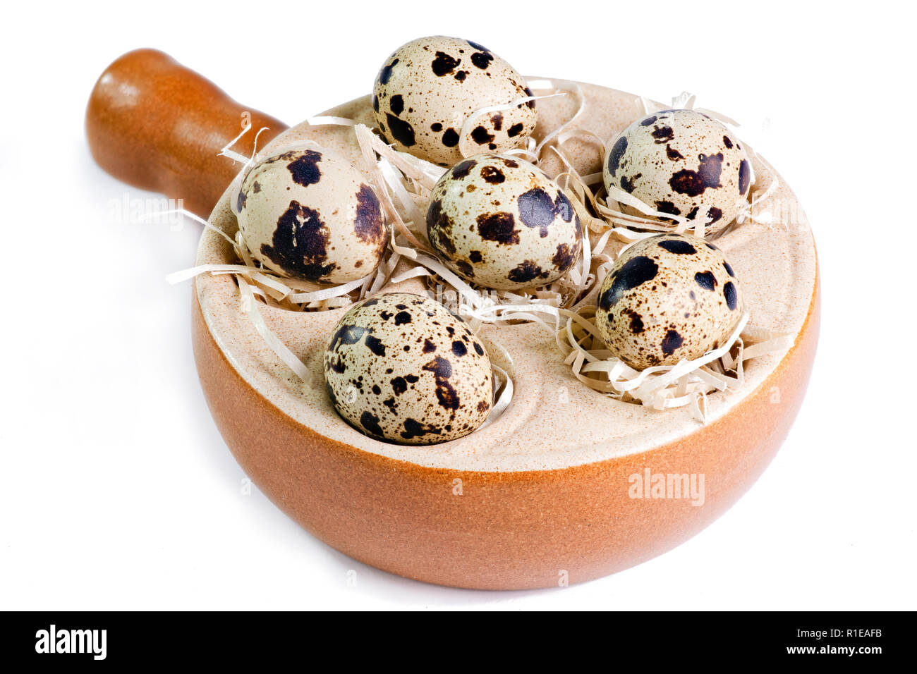 six quail eggs close up shot isolated on a white background Stock Photo