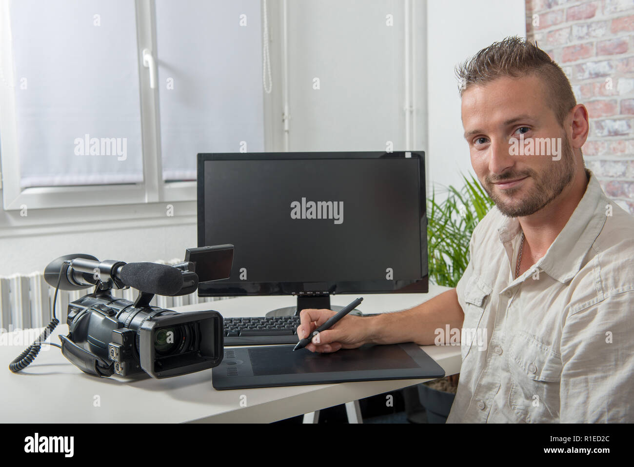 man video editor using a graphic tablet Stock Photo