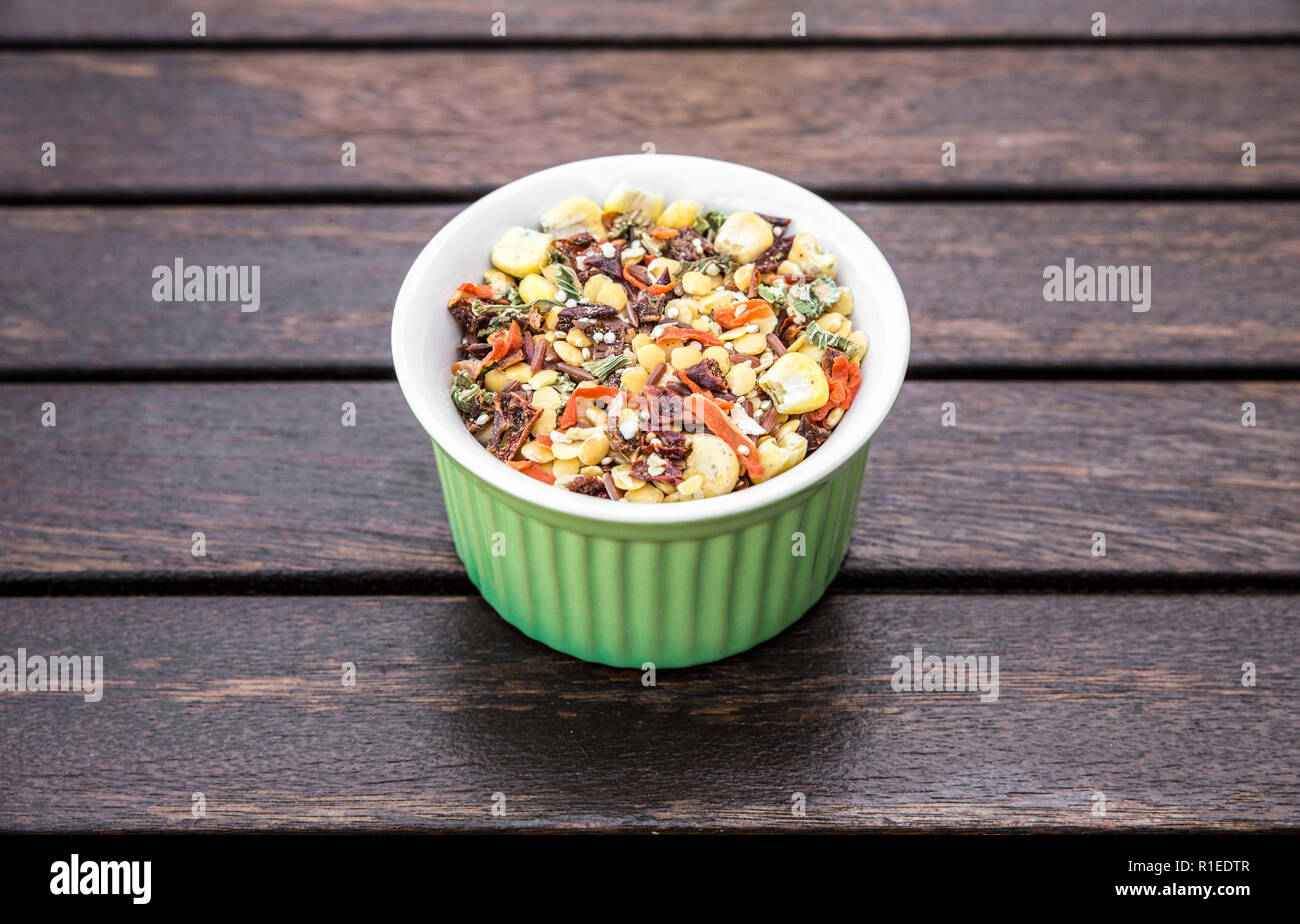 Bowl of dried soup mix, different ingredients on brown wooden background with copy space. Stock Photo