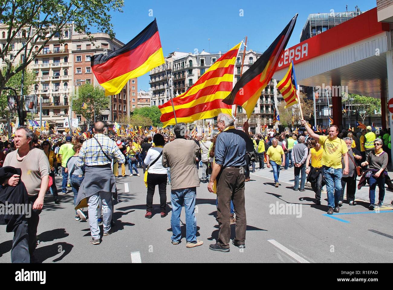 Catalans wave flags during a Llibertat Presos Politics (Free Political Prisoners) march in central Barcelona, Spain on April 15, 2018. Stock Photo