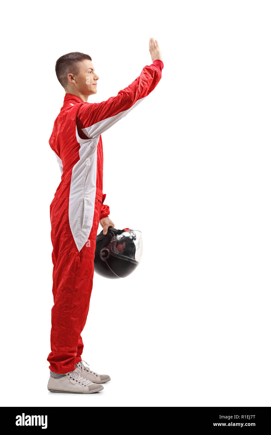 Full length profile shot of a young racer waving with his hand isolated on white background Stock Photo