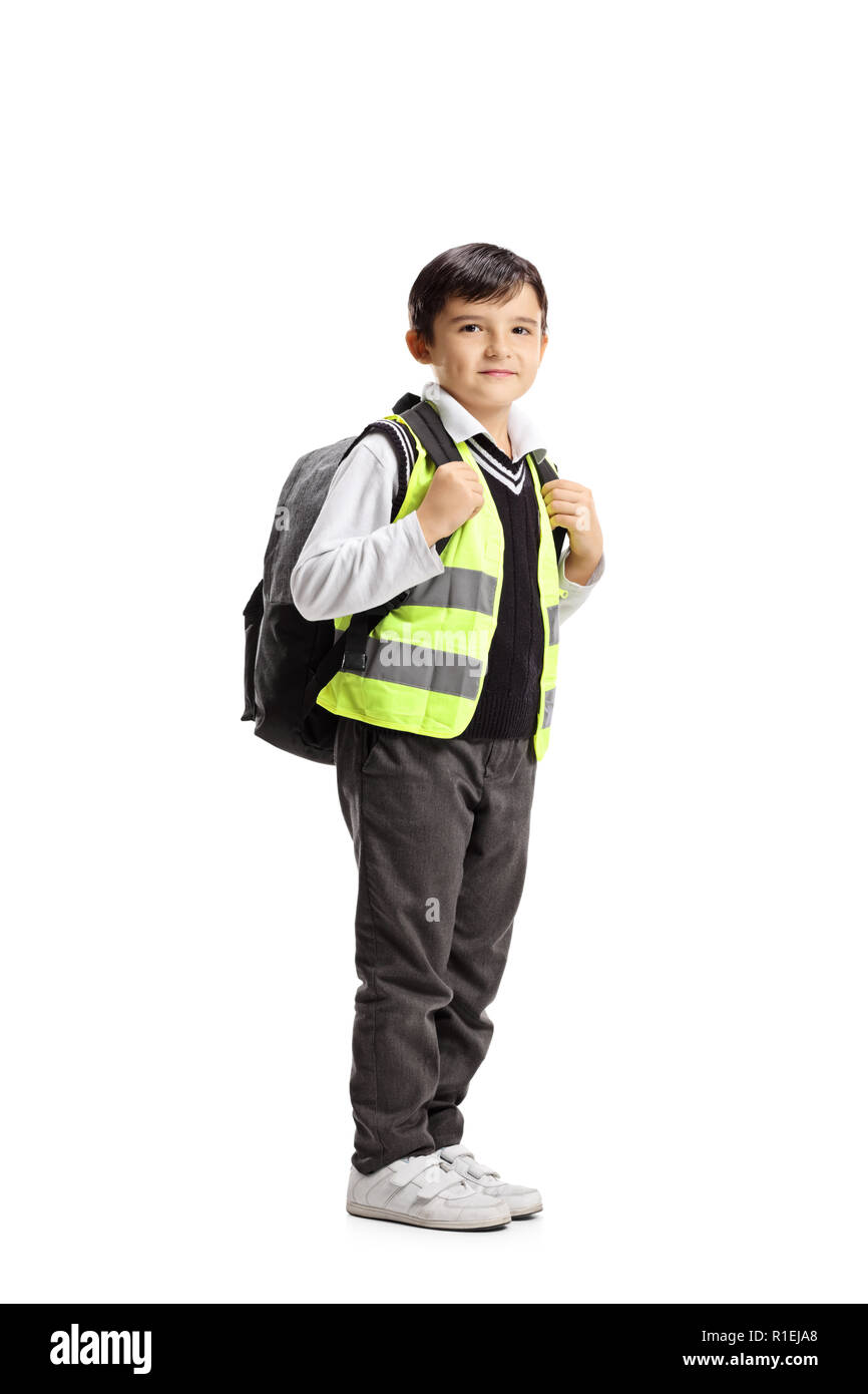 Full length shot of a schoolboy with backpack and safety vest  isolated on white background Stock Photo