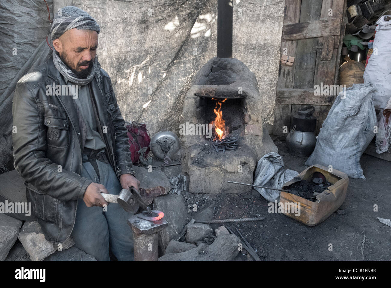 Portrait Of Middle-Aged Black-Smith Working In A Back Street, Bamyan, Bamyan Province, Afghanistan Stock Photo