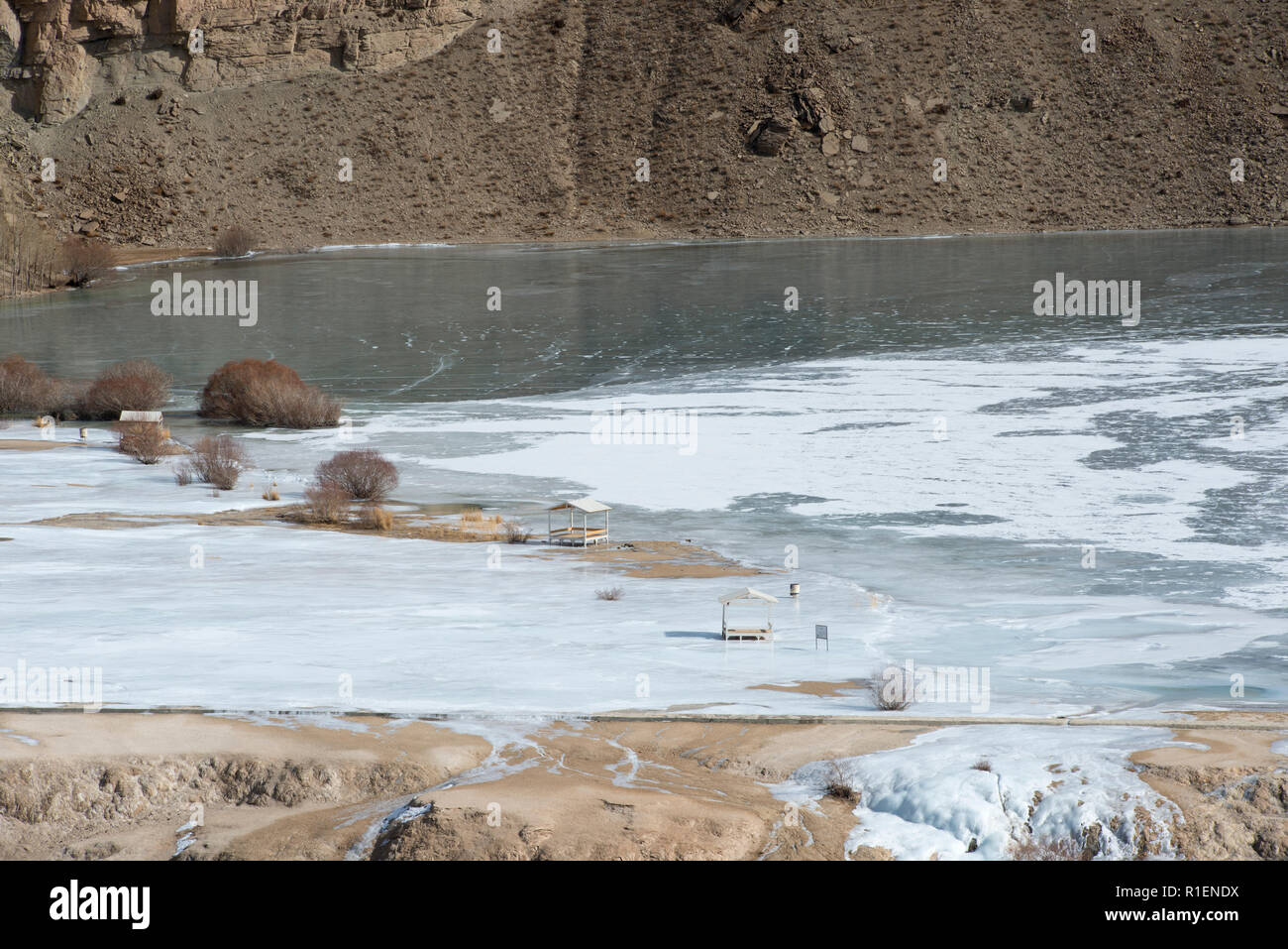 Frozen Lake With Picnic Cabins For Tourists, Band-e Amir National Park, Bamyan Province, Afghanistan Stock Photo