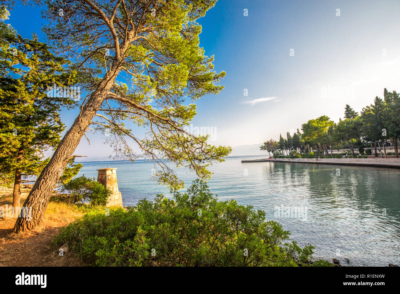Pebble beach on Brac island with turquoise clear ocean water, Supetar, Brac, Croatia. Stock Photo