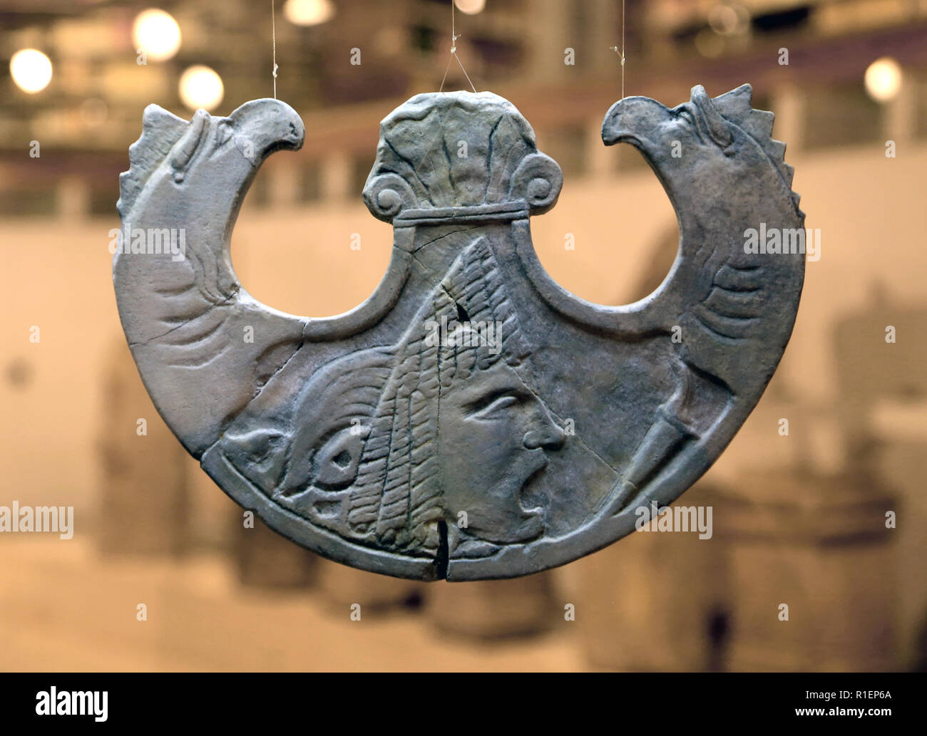 Oscillum pelta with mask,that hung on the doors as a protective periapt, 1st century AD. Roman Culture, carved in marble. Badalona. Stock Photo