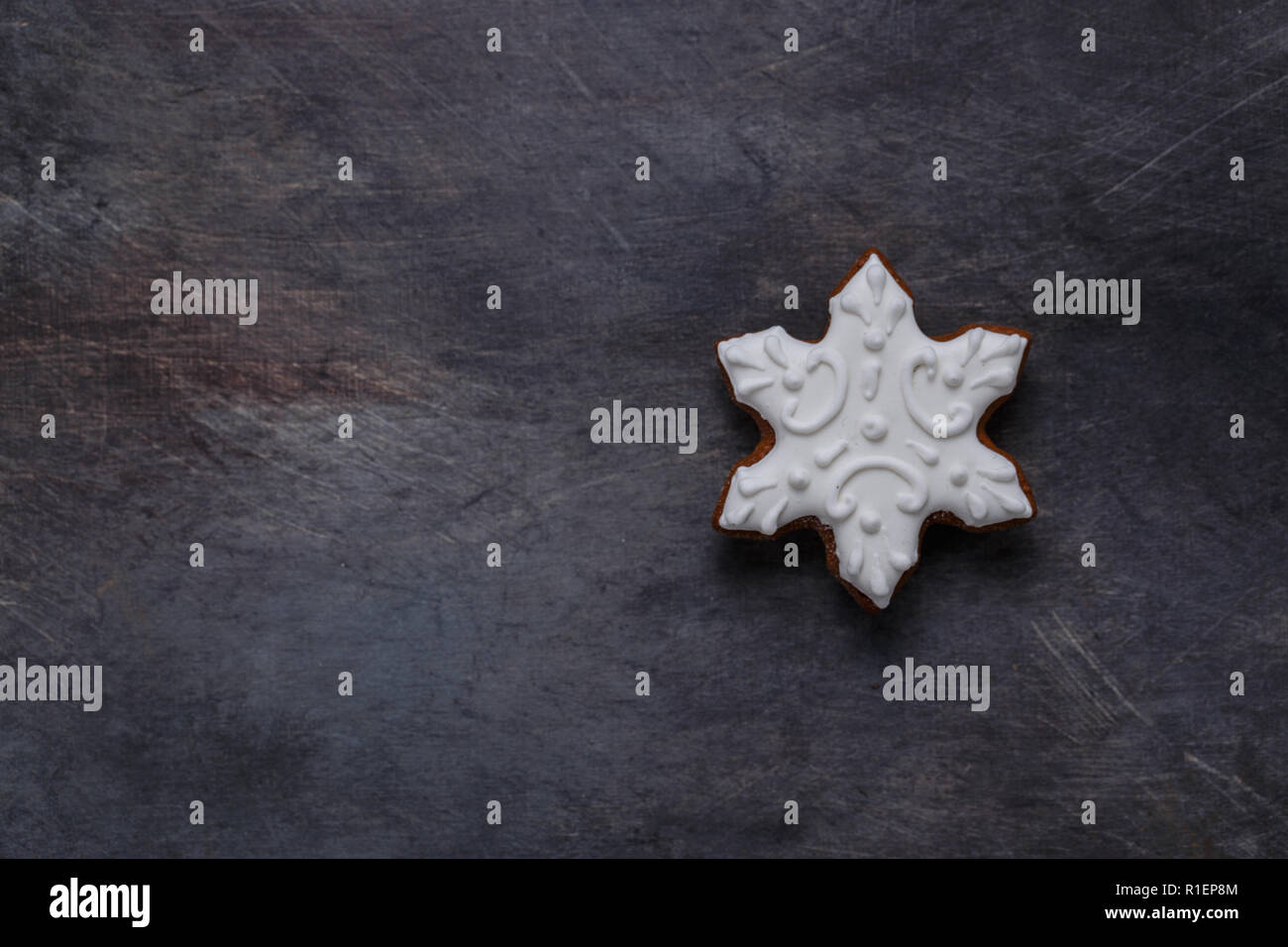 Gingerbread cookies snowflake on dark background, copyspace Stock Photo