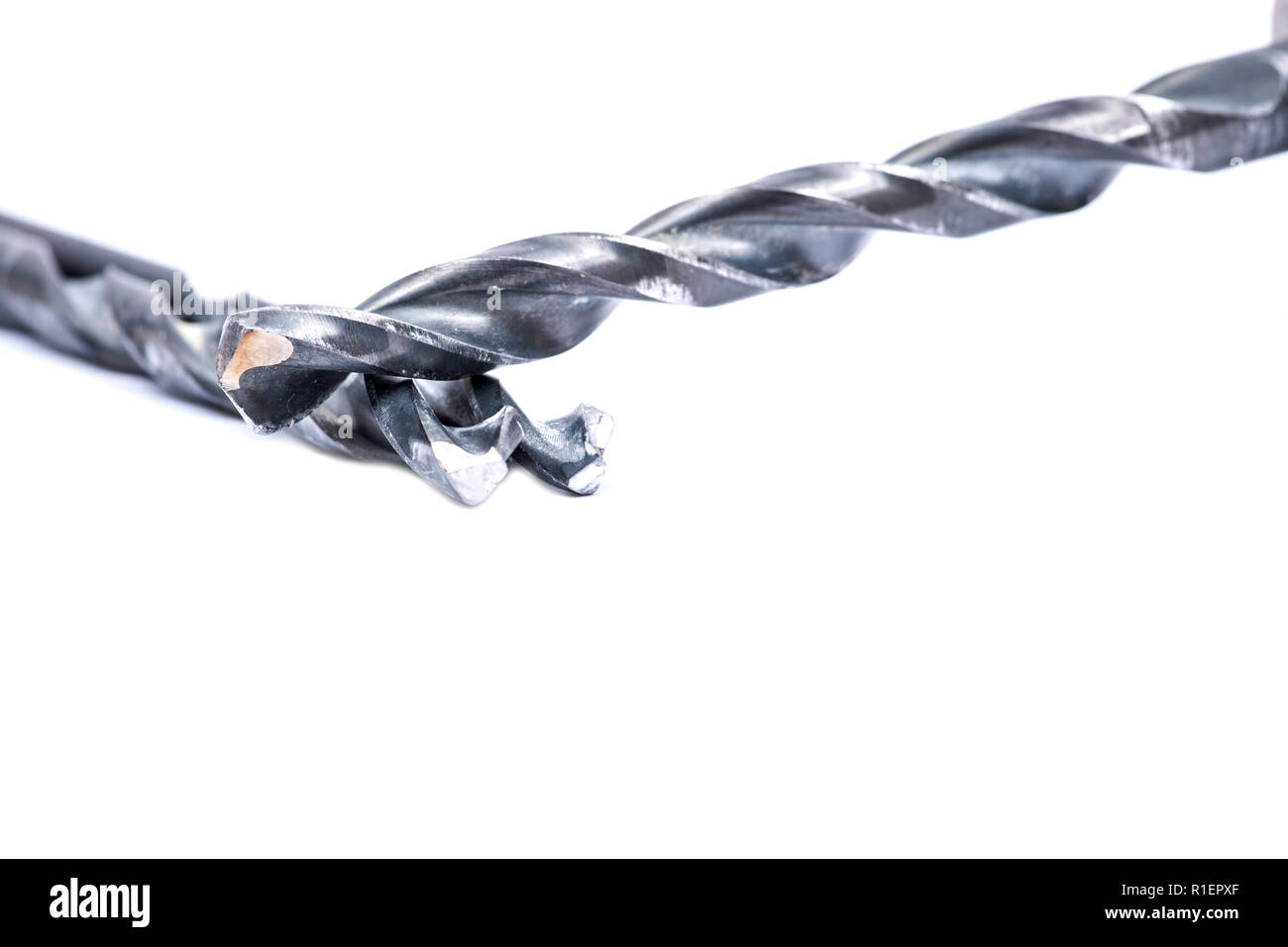 Old used drill bits isolated on white background Stock Photo - Alamy