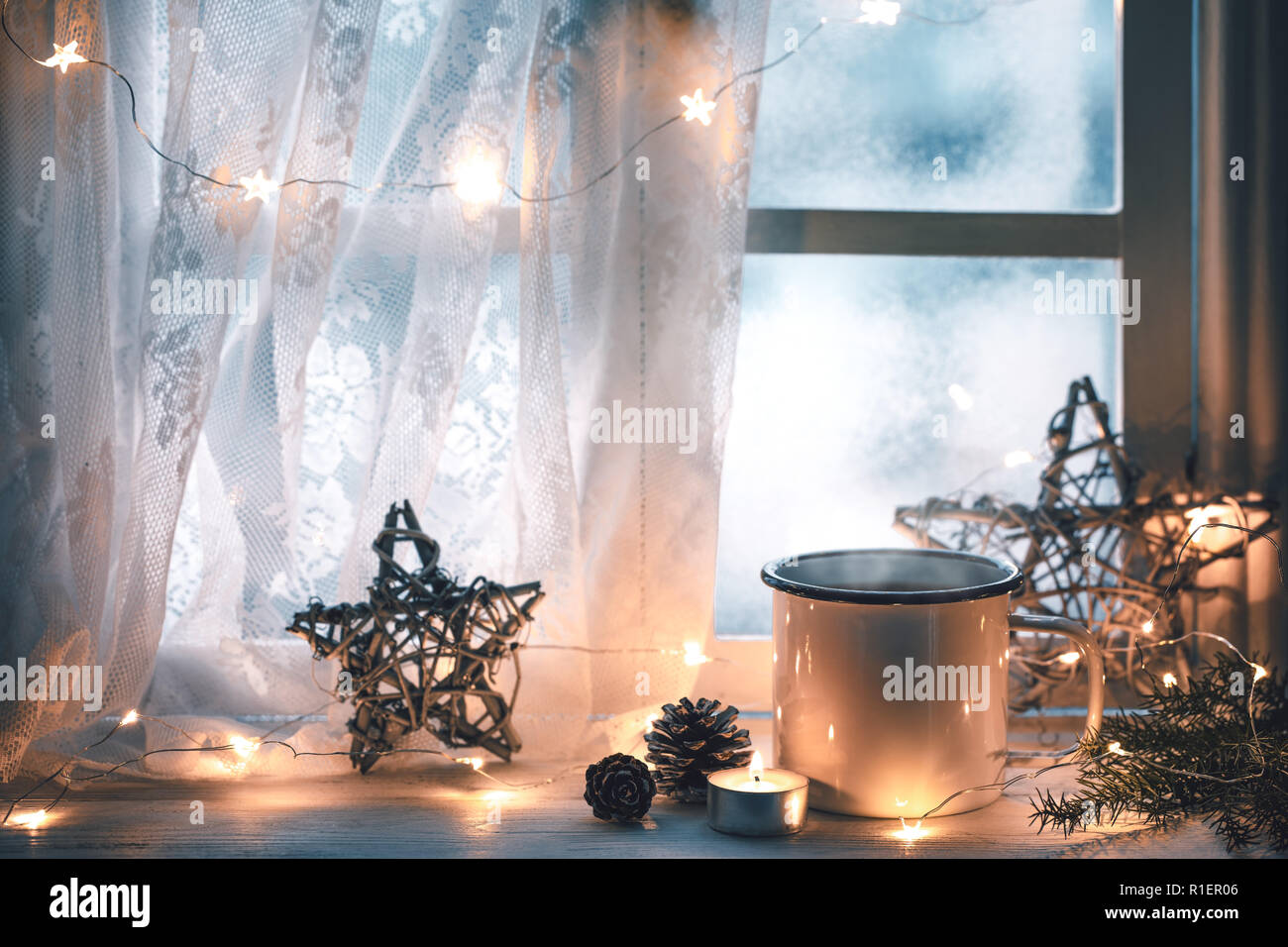 Merry Christmas and happy holidays Window with a cup of hot drink,new year decoration. Stock Photo