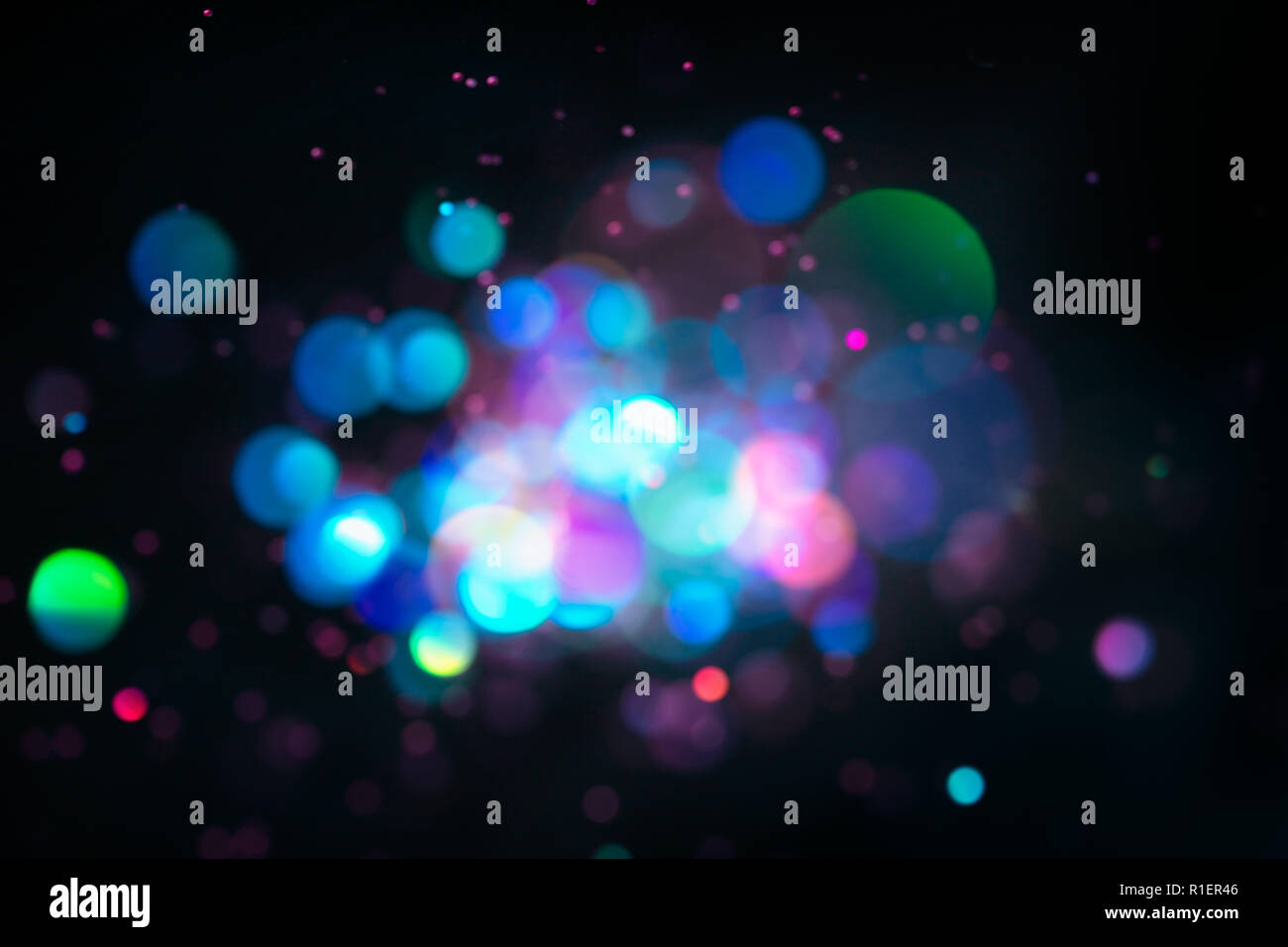 Blurred defocused lights on dark background Stock Photo