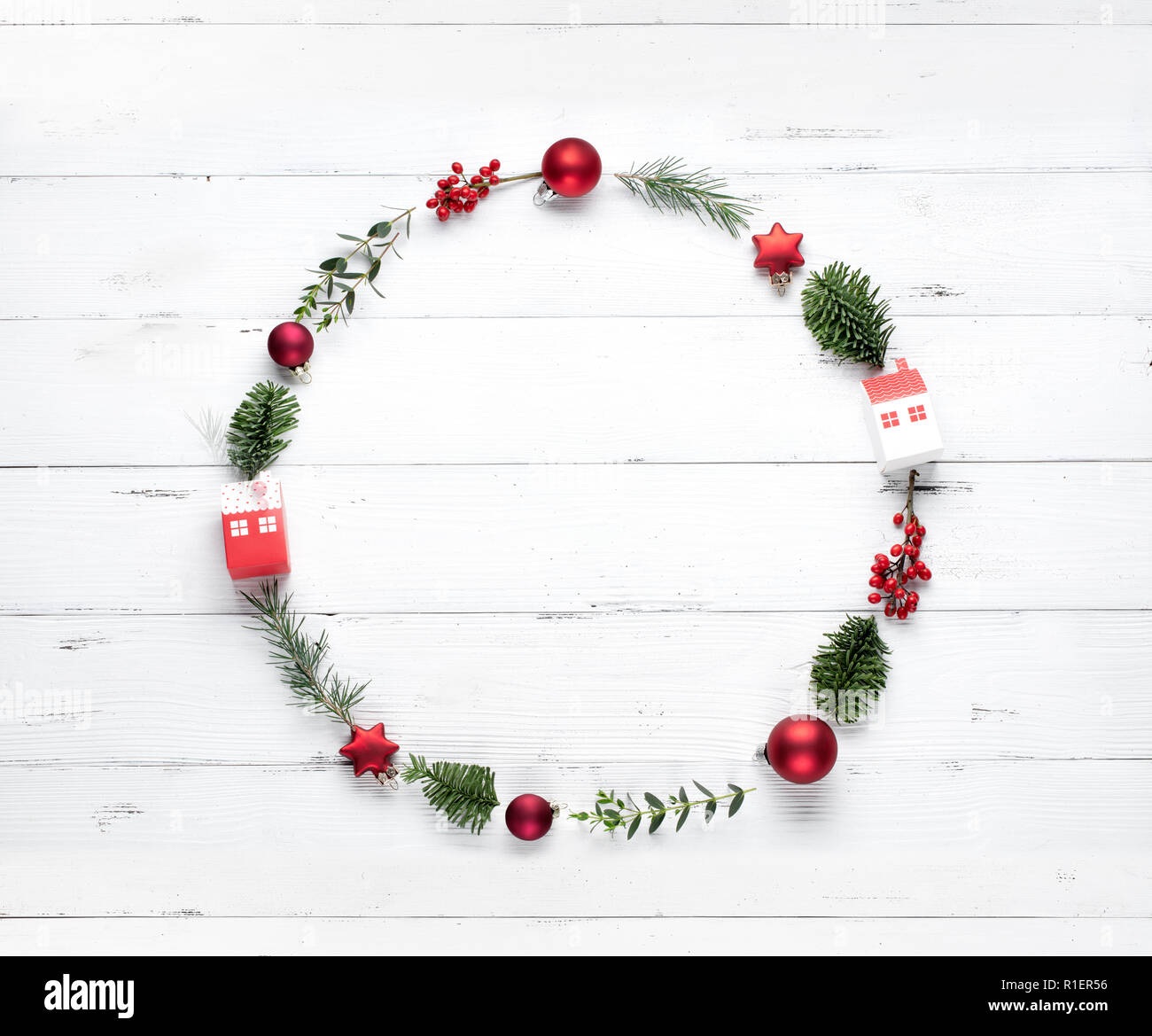Christmas wreath made of fir branches, apple and berry on white ...
