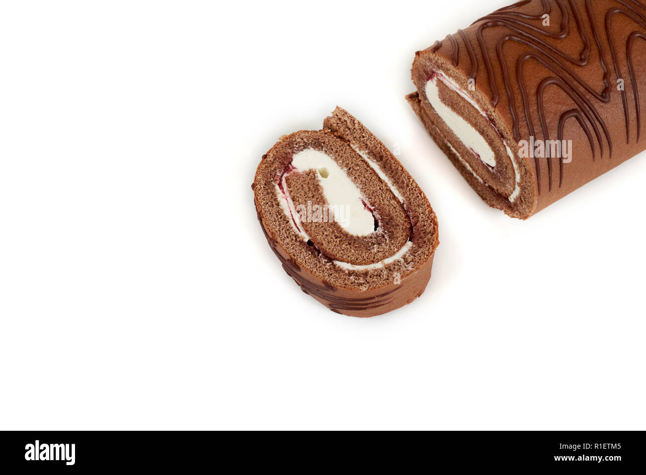 Chocolate biscuit roll cake isolated on white background Stock Photo