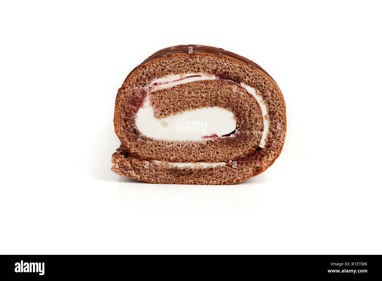 Chocolate biscuit roll cake isolated on white background Stock Photo