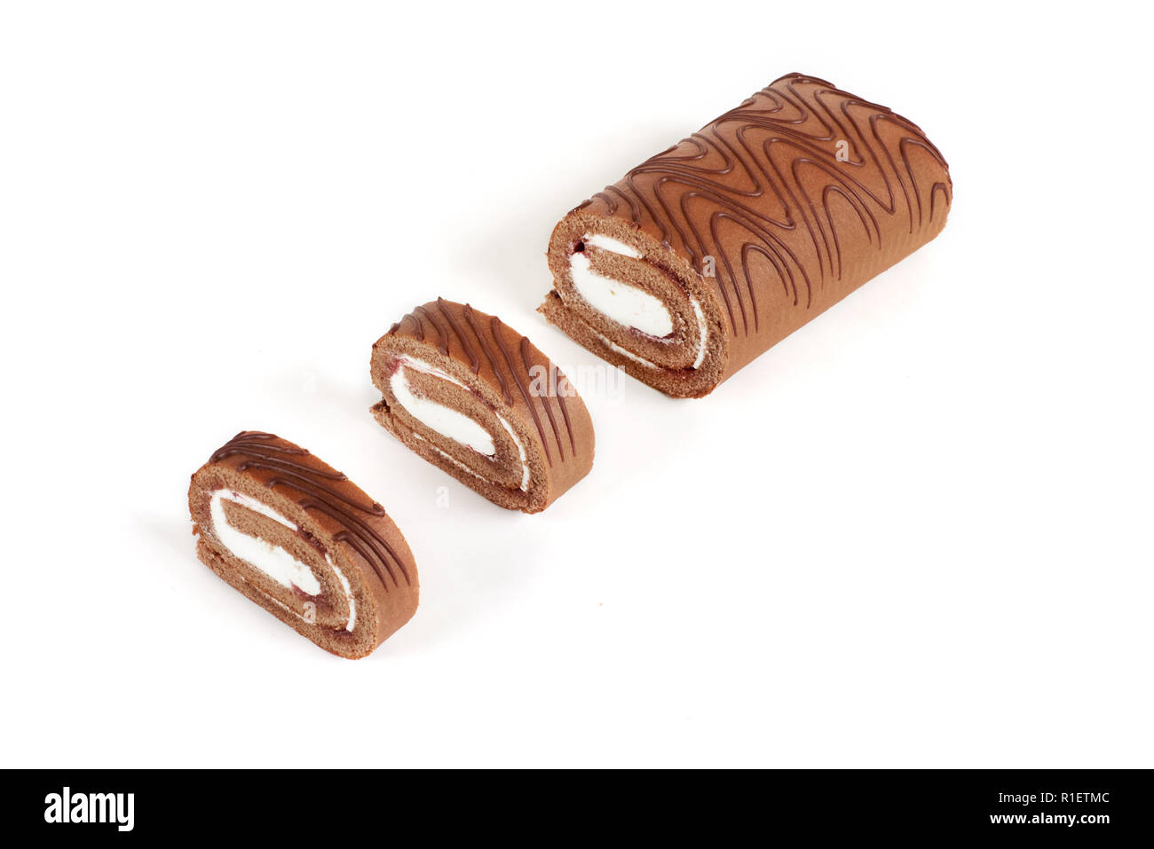 Chocolate biscuit roll cake isolated on white background Stock Photo