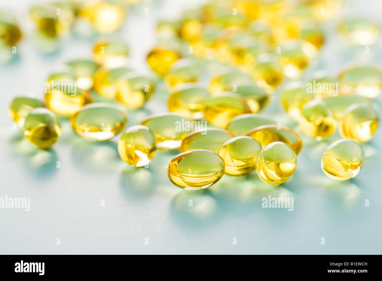 Omega 3 gel capsules. Fish oil pills. Healthy omega3 on blue background Stock Photo Alamy