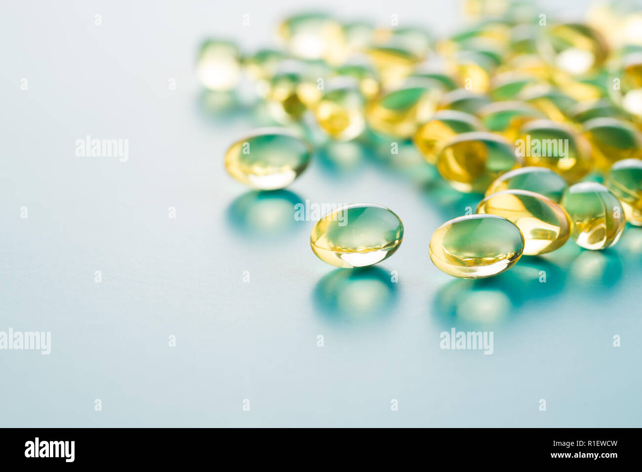 Omega 3 gel capsules. Fish oil pills. Healthy omega3 on blue background Stock Photo Alamy